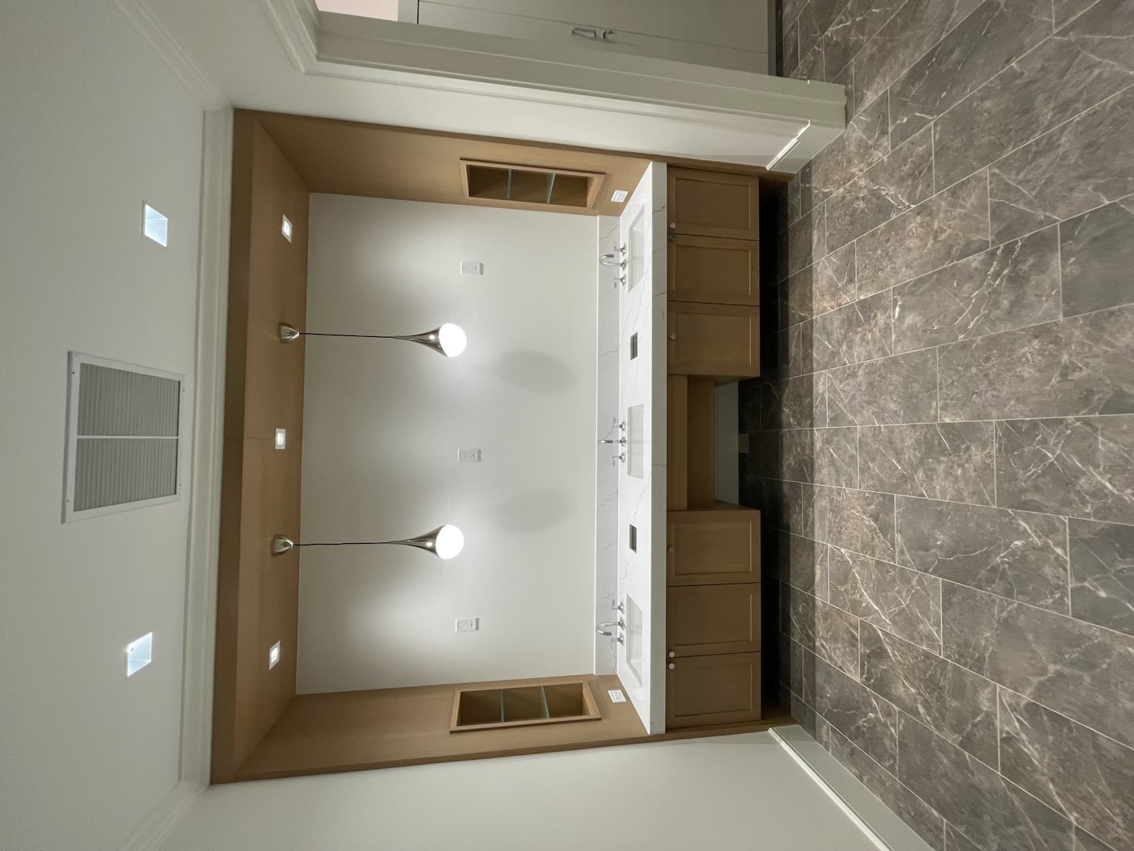 Custom double vanity with rift white oak cabinetry and quartz countertop, Hideaway Beach Marco Island
